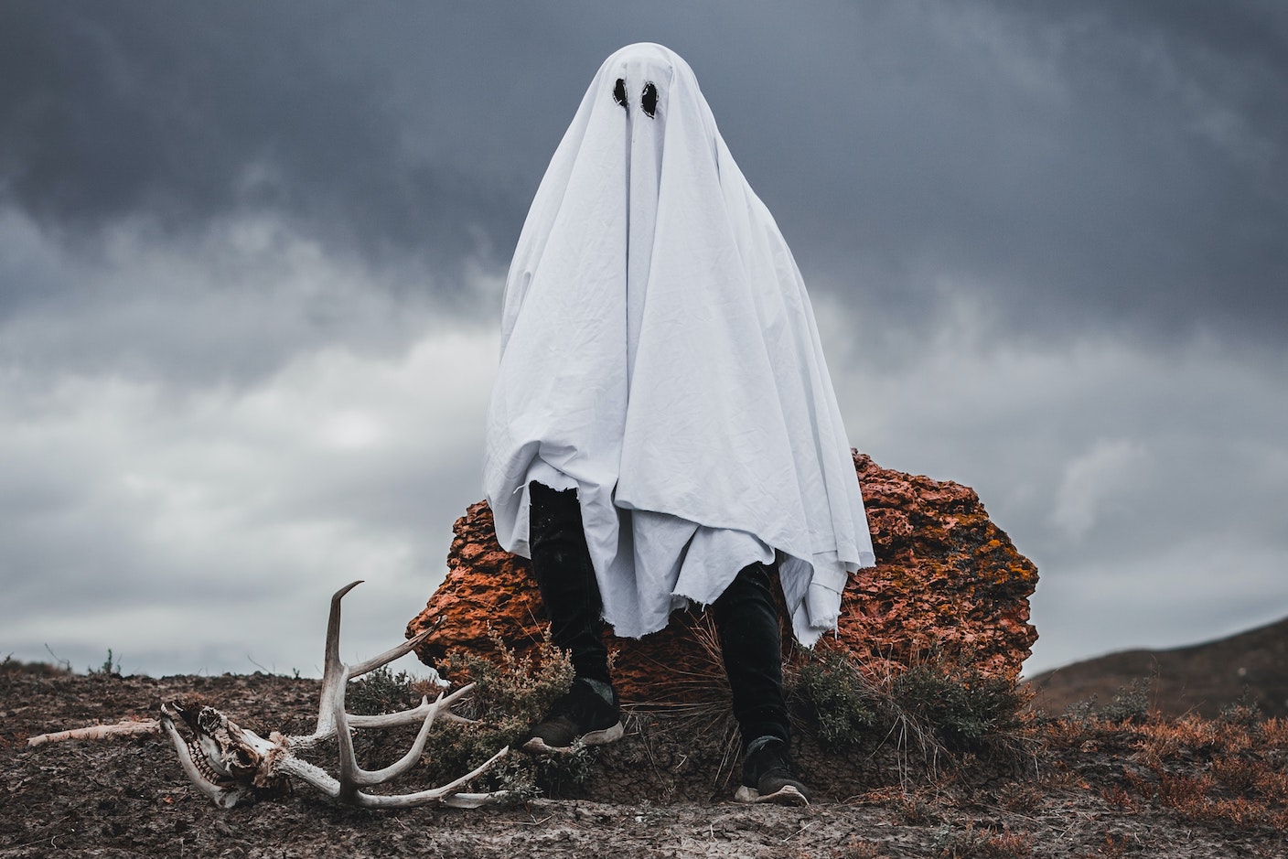 Image of a man wearing a sheet dressed to look like a ghost