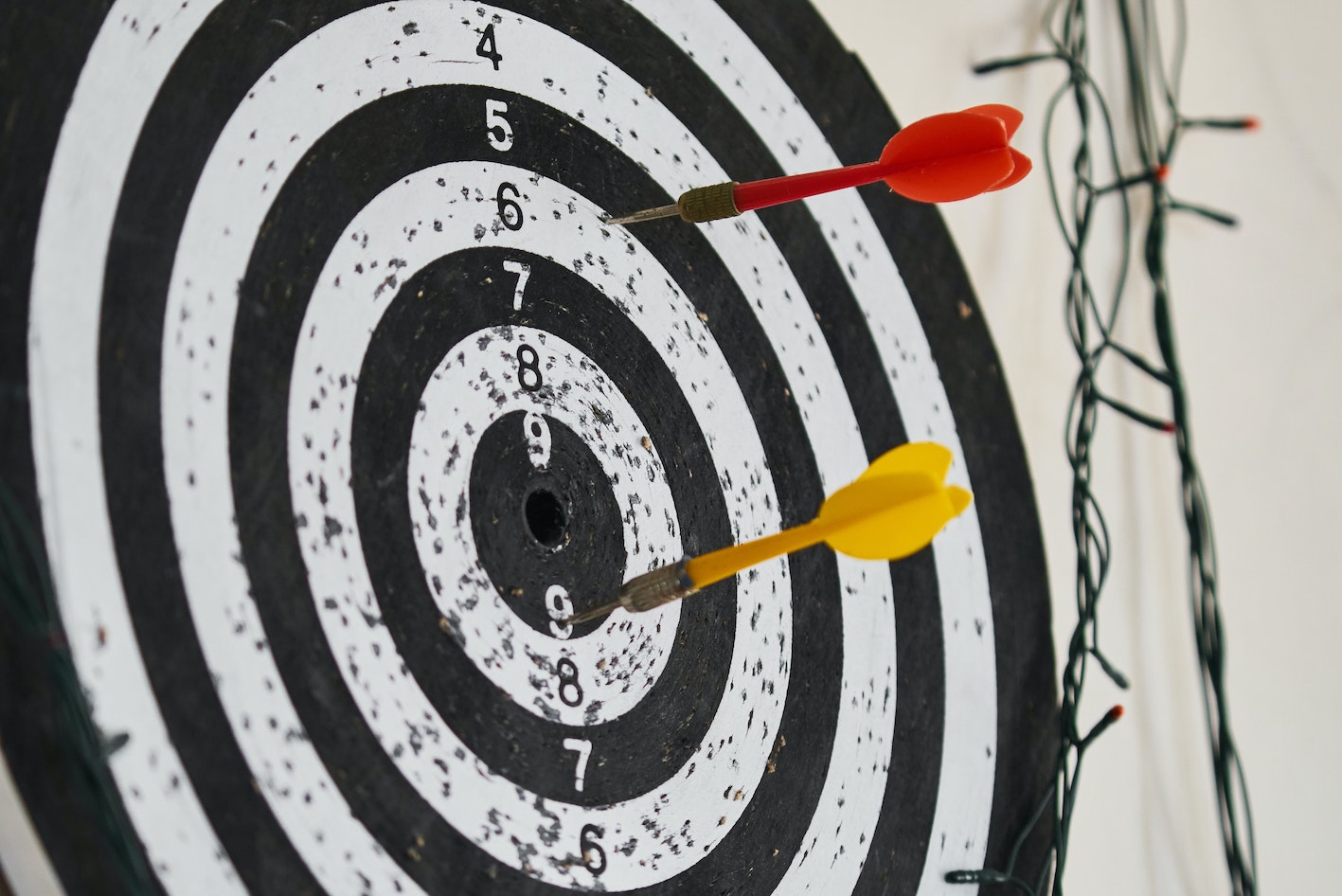 image of a dart board with darts showing how we need tips to help set clear objectives