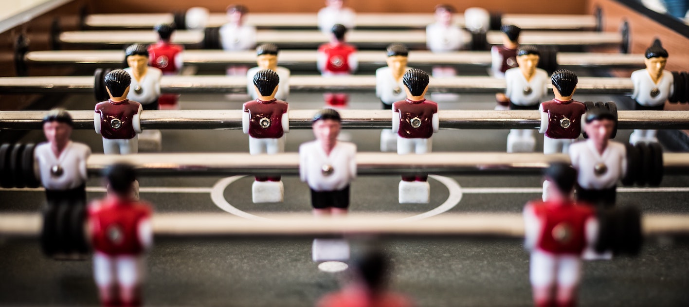 Photo of fussball players all in lines as part of at team. Describing Is Personality Profiling a Good Idea For a Team?