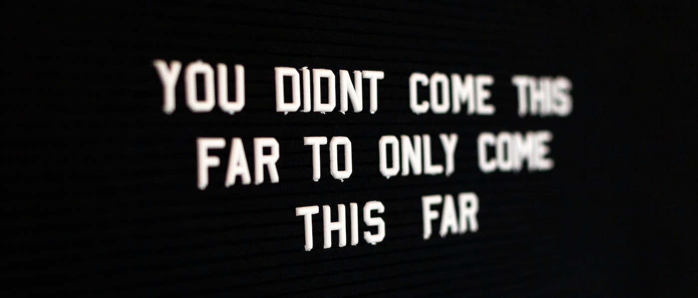 When Should I Get A Mentor? Picture shows a black background with a white quote on it saying "you didn't come this far to only come this far"