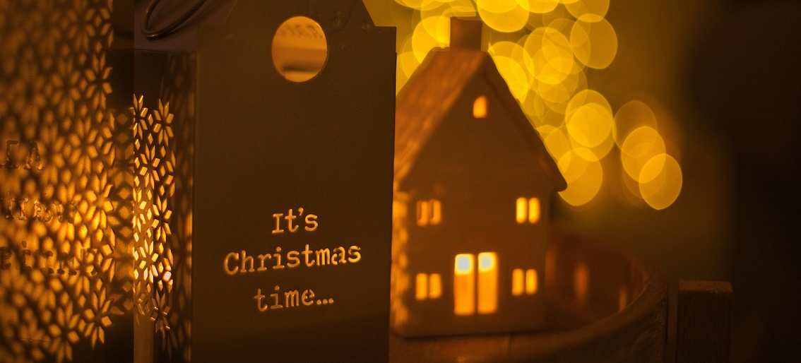 Candle holder house with 'It's Christmas time' written on it.